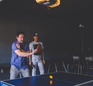 It give You More Energy US man in blue playing table tennis with another man as his audience 300x275 - It give You More Energy-US-man-in-blue-playing-table-tennis-with-another-man-as-his-audience